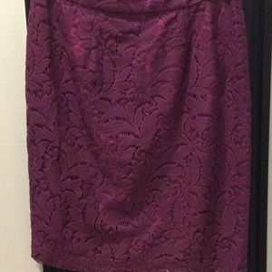 Cabi, lace material with a complimentary color lining.